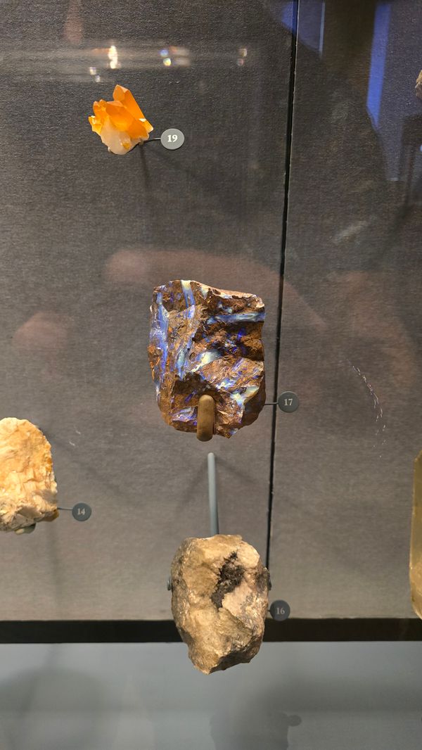 A bronze colored meteorise with bright blue streaks.