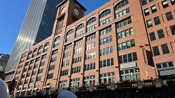 A brick building shot from a boat on the Chicago River