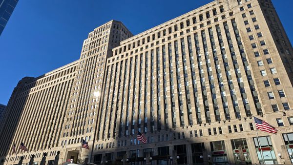 A large building shot from a boat on the Chicago River